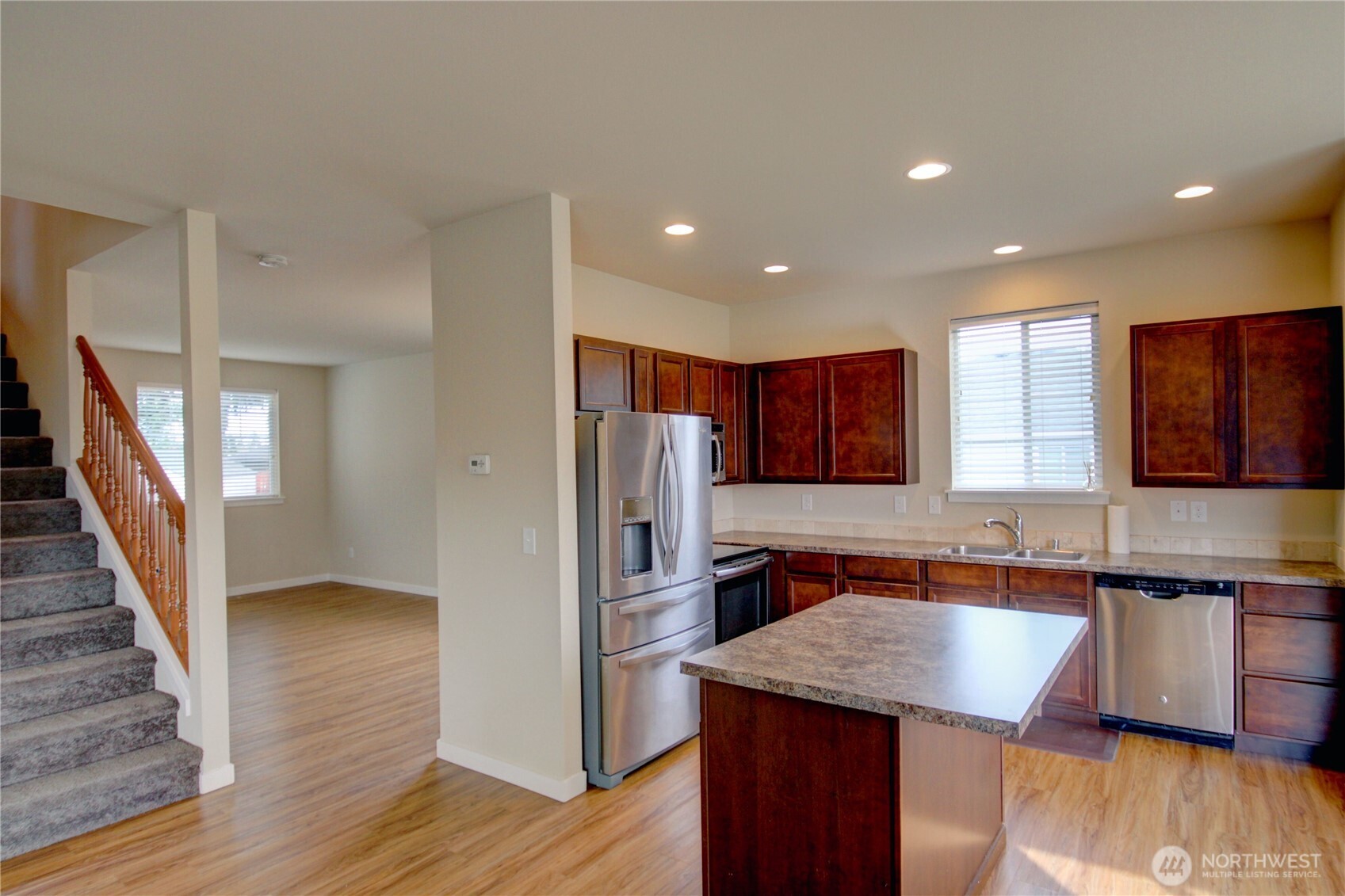 1709 Hillcrest Loop Mount Vernon, WA 98274 - Photo 16 of 40 a kitchen with stainless steel appliances granite countertop refrigerator sink and cabinets