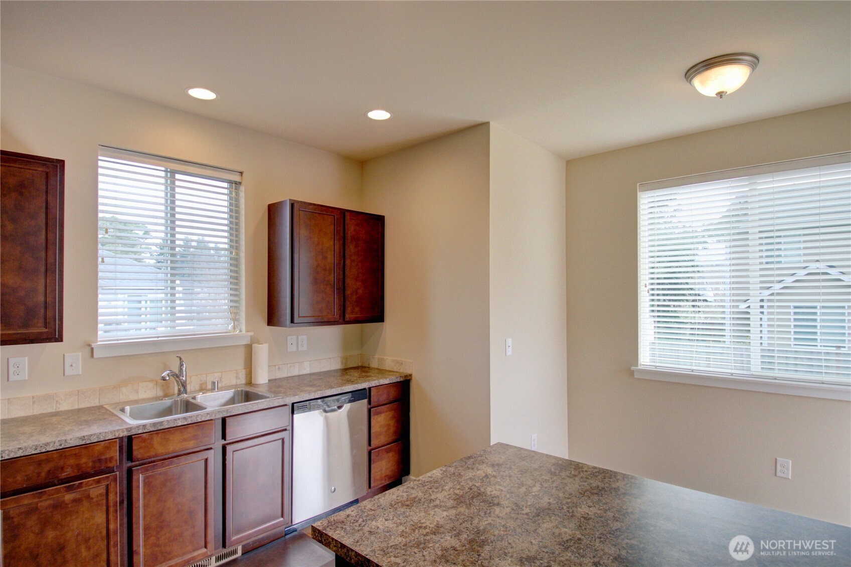 1709 Hillcrest Loop Mount Vernon, WA 98274 - Photo 17 of 40 a kitchen with stainless steel appliances granite countertop wooden cabinets a sink and a window