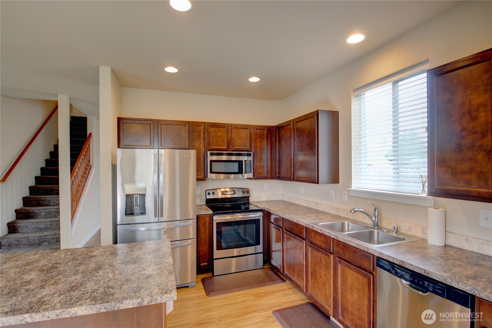 1709 Hillcrest Loop Mount Vernon, WA 98274 - Photo 18 of 40 a large kitchen with stainless steel appliances granite countertop a sink and a stove