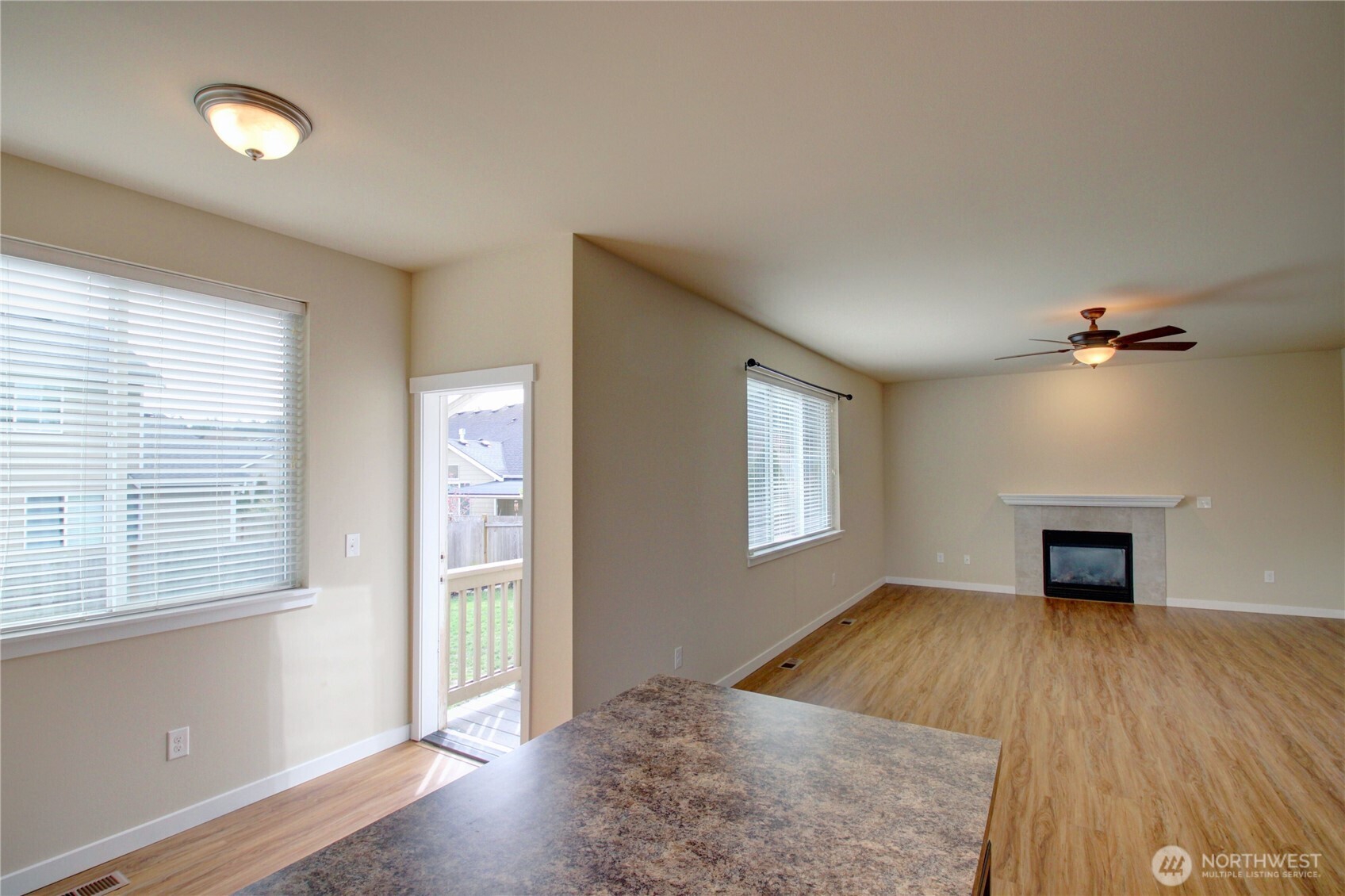 1709 Hillcrest Loop Mount Vernon, WA 98274 - Photo 22 of 40 an empty room with windows and fireplace