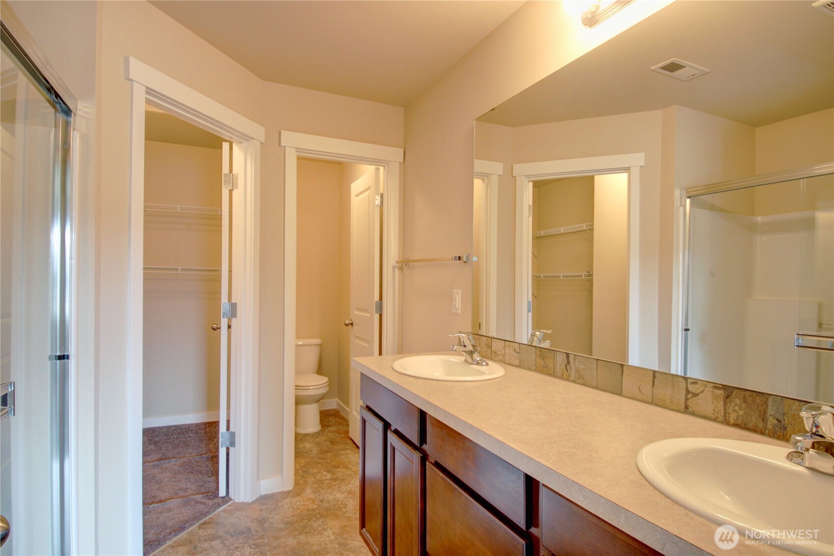 1709 Hillcrest Loop Mount Vernon, WA 98274 - Photo 29 of 40 a bathroom with a sink double vanity and a mirror
