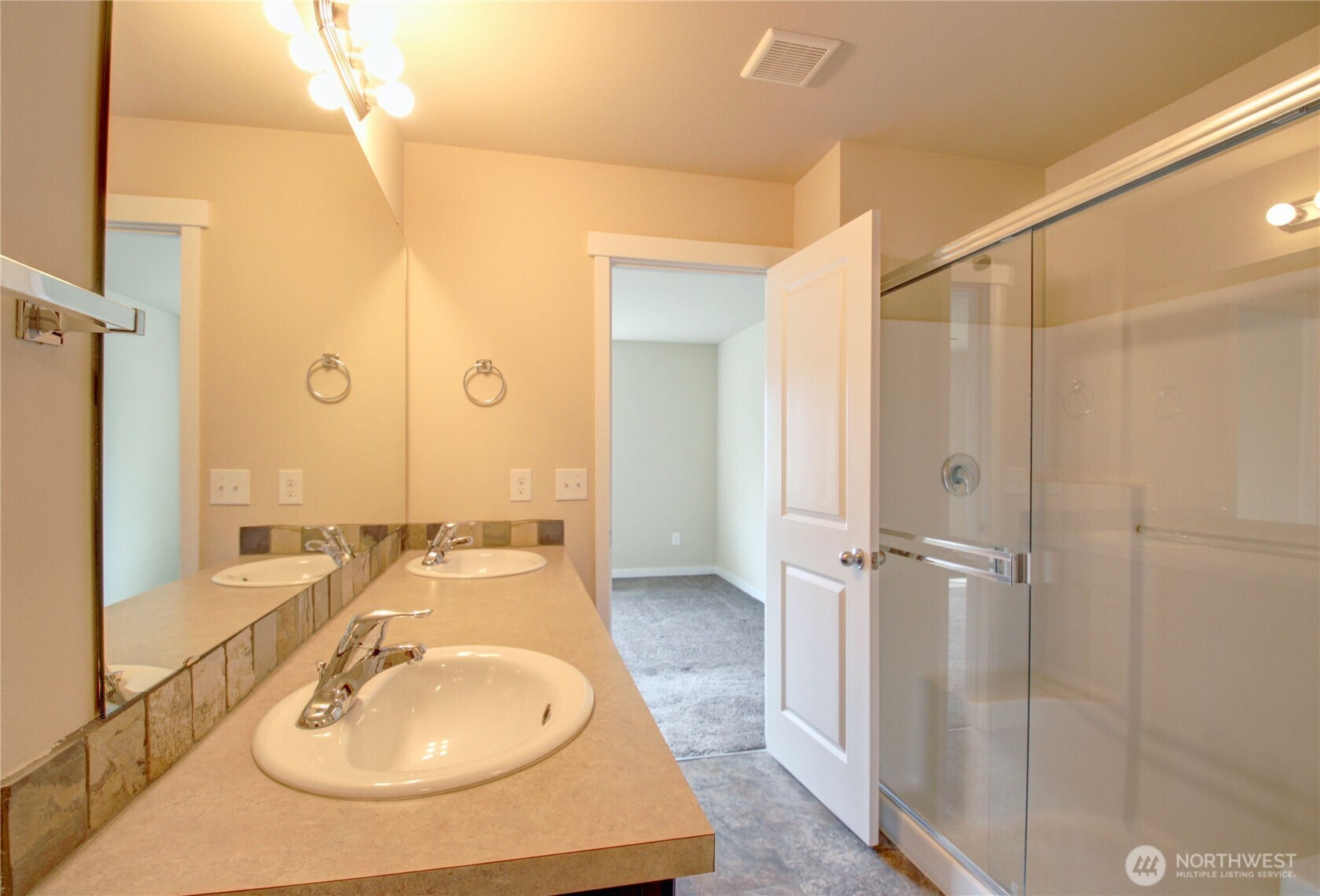 1709 Hillcrest Loop Mount Vernon, WA 98274 - Photo 30 of 40 a bathroom with a sink a mirror and a shower