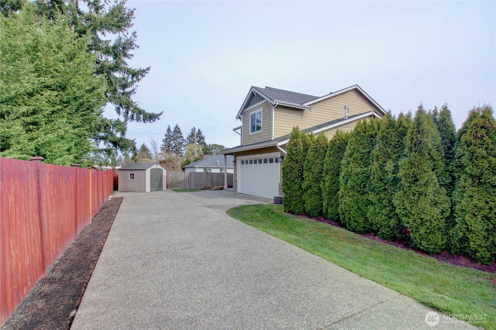 1709 Hillcrest Loop Mount Vernon, WA 98274 - Photo 3 of 40 a front view of a house with a yard and garage