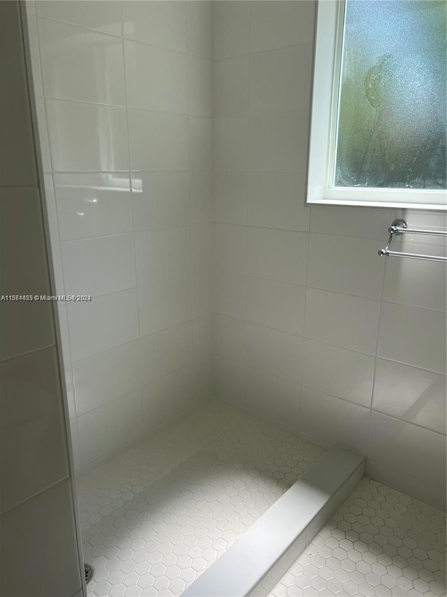 245 Southwest 24th Road, Unit 1 Miami, FL 33129 - Photo 7 of 14 a bathroom with a window