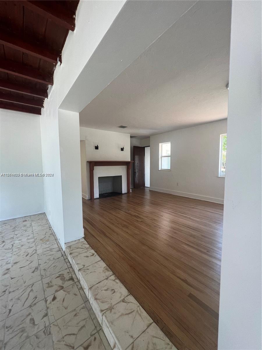 245 Southwest 24th Road, Unit 1 Miami, FL 33129 - Photo 10 of 14 a view of empty room with wooden floor
