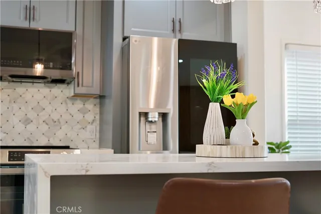 a view of living room with furniture and a flat screen tv