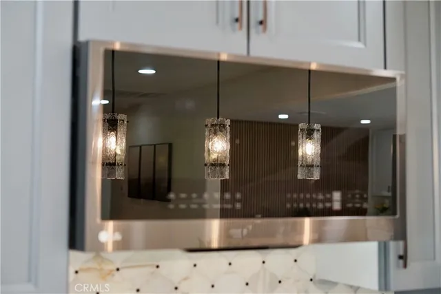 a bathroom with a sink a large mirror and shower
