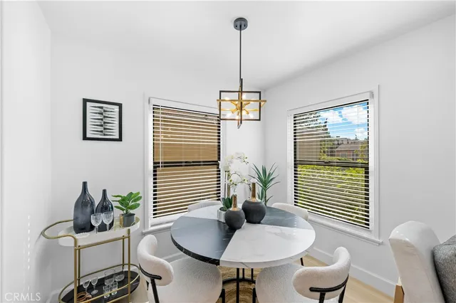 a view of a livingroom with furniture and a window