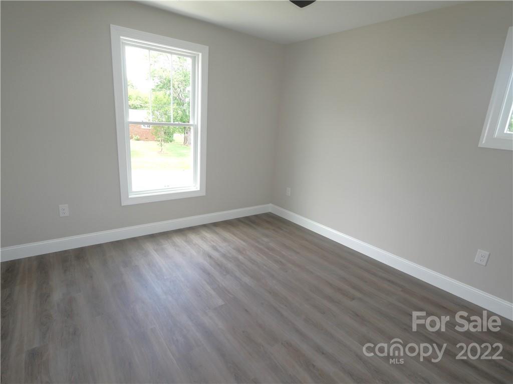 2636 2nd Street Northeast Hickory, NC 28601 - Photo 21 of 23 an empty room with wooden floor and windows