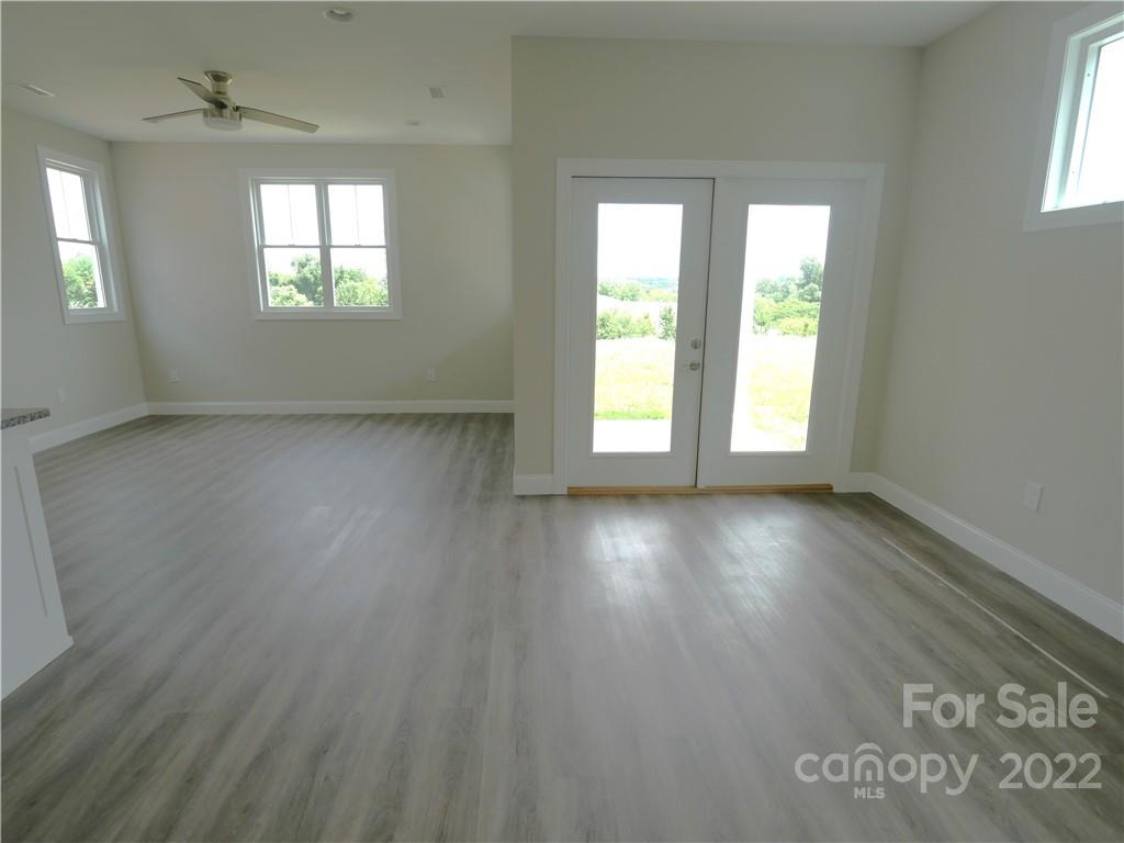 2636 2nd Street Northeast Hickory, NC 28601 - Photo 10 of 23 an empty room with wooden floor and windows
