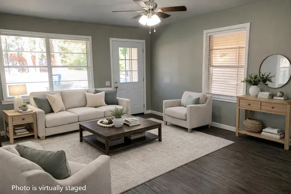 a living room with furniture and a large window