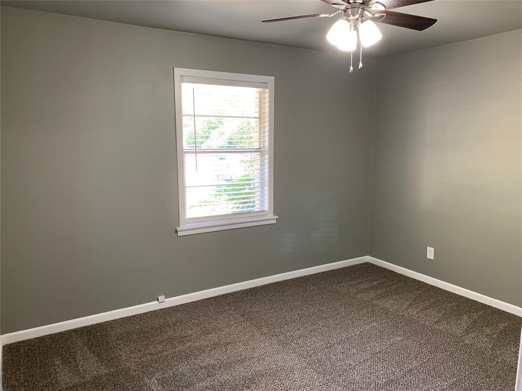 721 Barbara Street Athens, TX 75751 - Photo 11 of 18 an empty room with a window