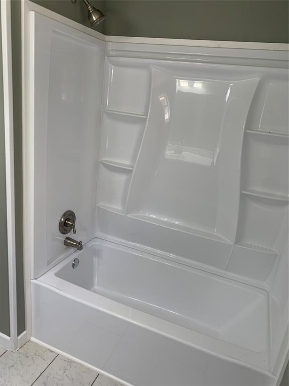 721 Barbara Street Athens, TX 75751 - Photo 14 of 18 a bathroom with a bathtub