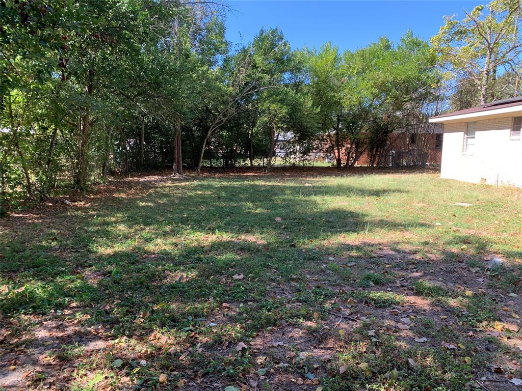 721 Barbara Street Athens, TX 75751 - Photo 18 of 18 a view of yard with green space and trees in the background