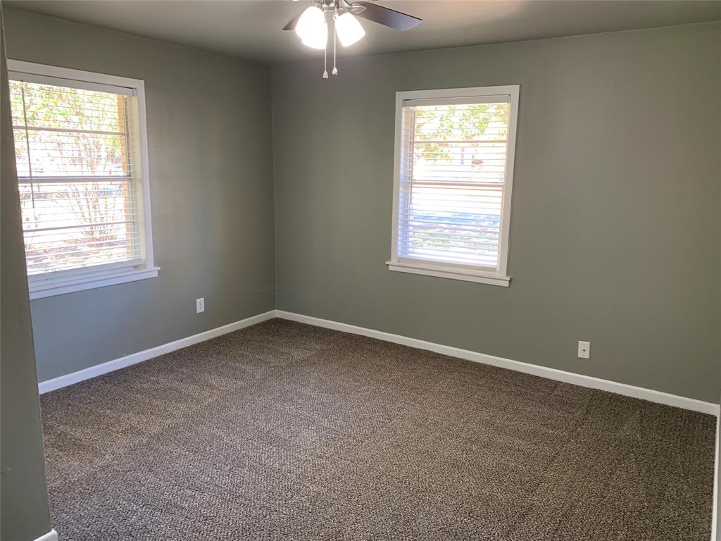 721 Barbara Street Athens, TX 75751 - Photo 8 of 18 an empty room with a window