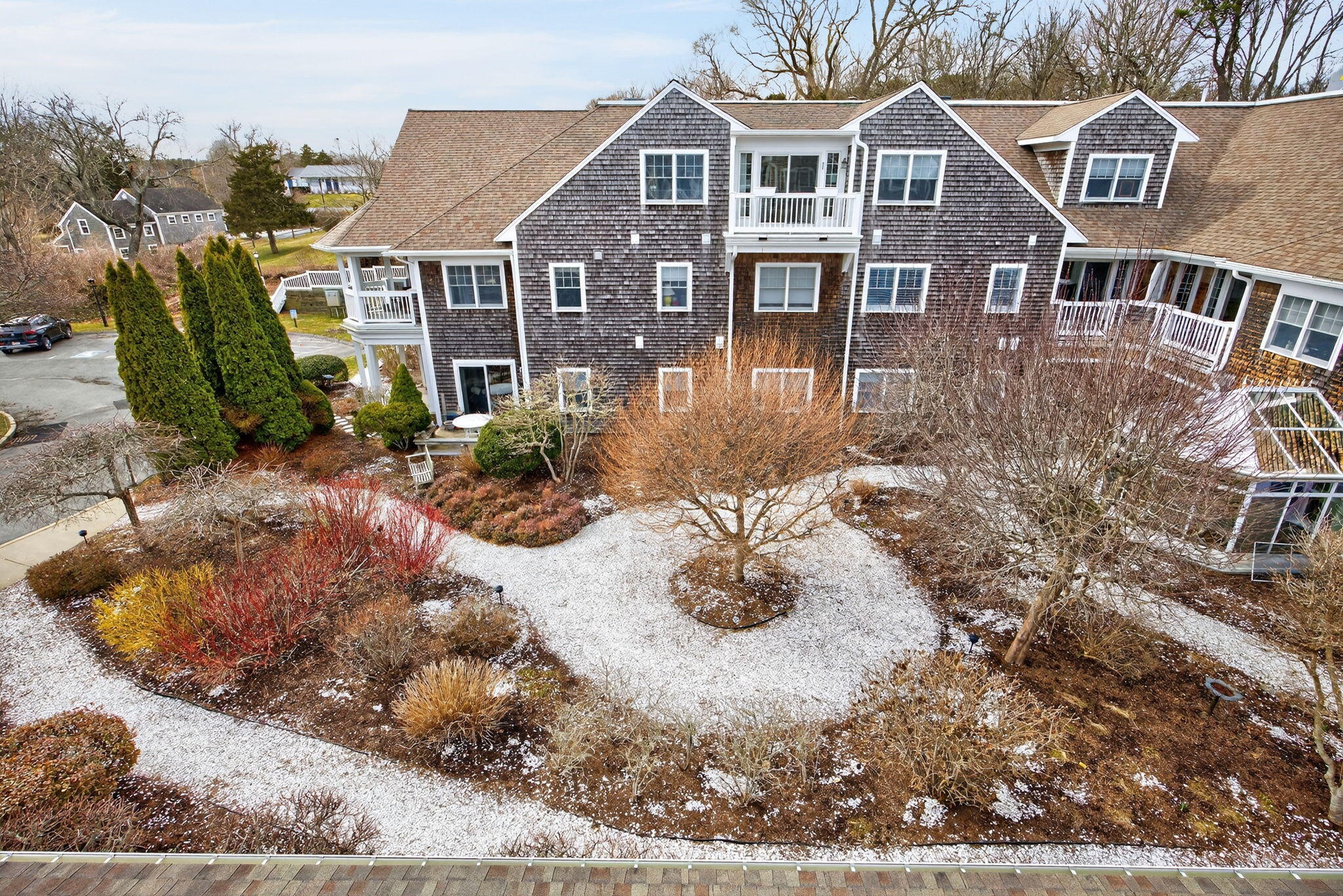 912 Main Street, Unit 308 Chatham, MA 02633 - Photo 14 of 65 a front view of a house with garden
