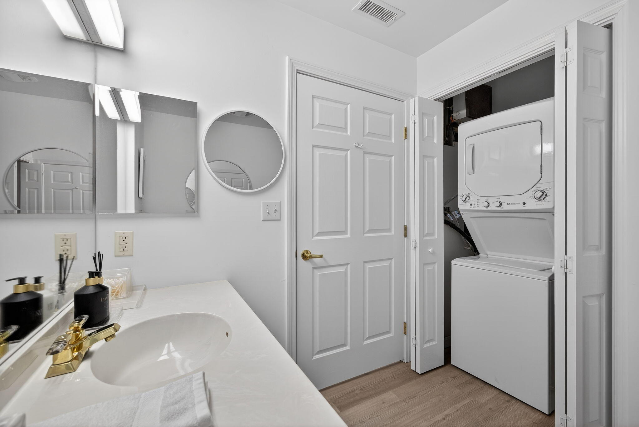 912 Main Street, Unit 308 Chatham, MA 02633 - Photo 33 of 65 a bathroom with a sink and a mirror