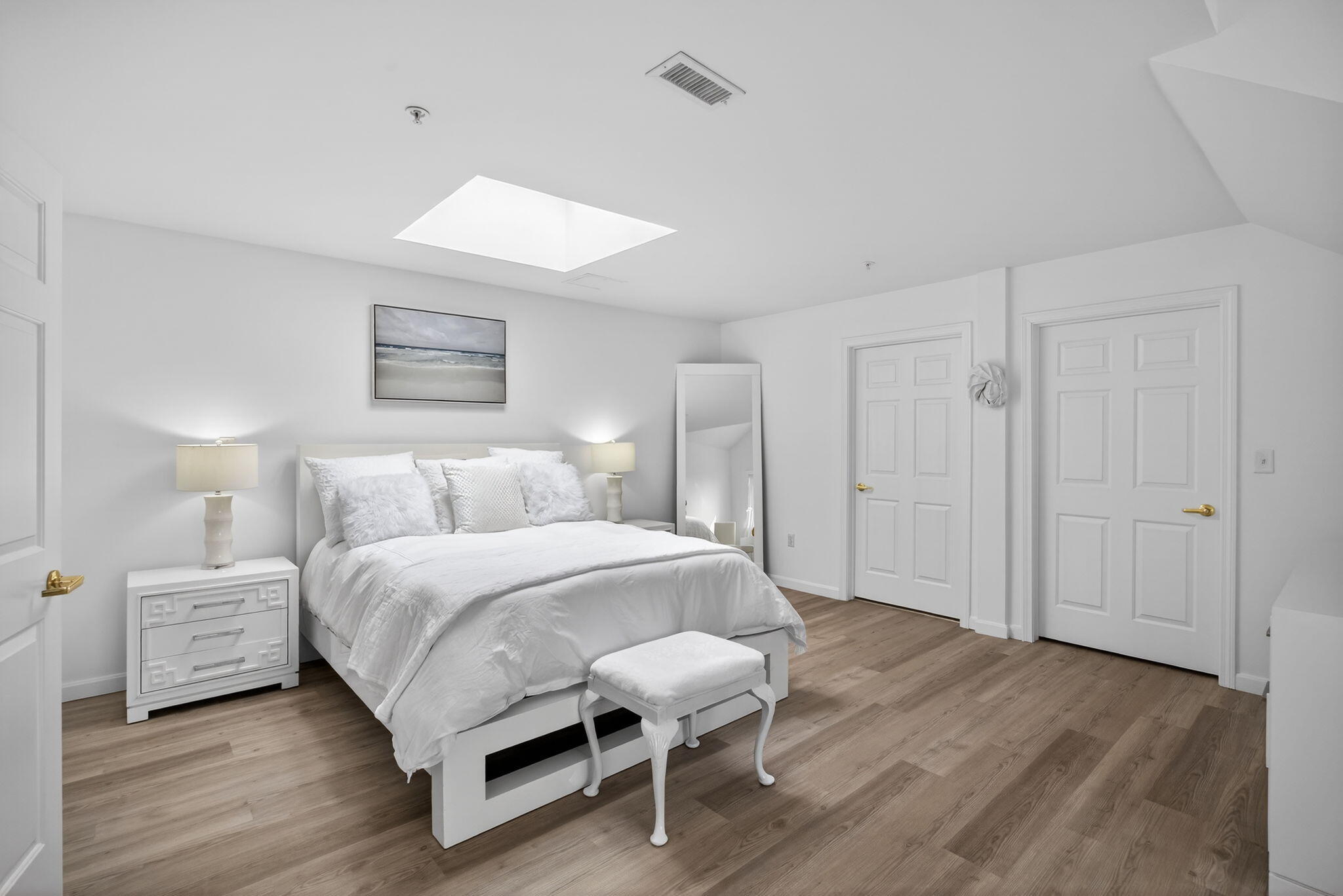 912 Main Street, Unit 308 Chatham, MA 02633 - Photo 34 of 65 a spacious bedroom with a bed and a table