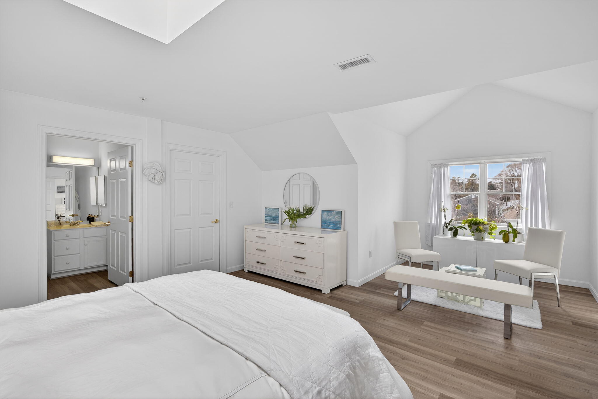 912 Main Street, Unit 308 Chatham, MA 02633 - Photo 43 of 65 a bedroom with a bed and wooden floor