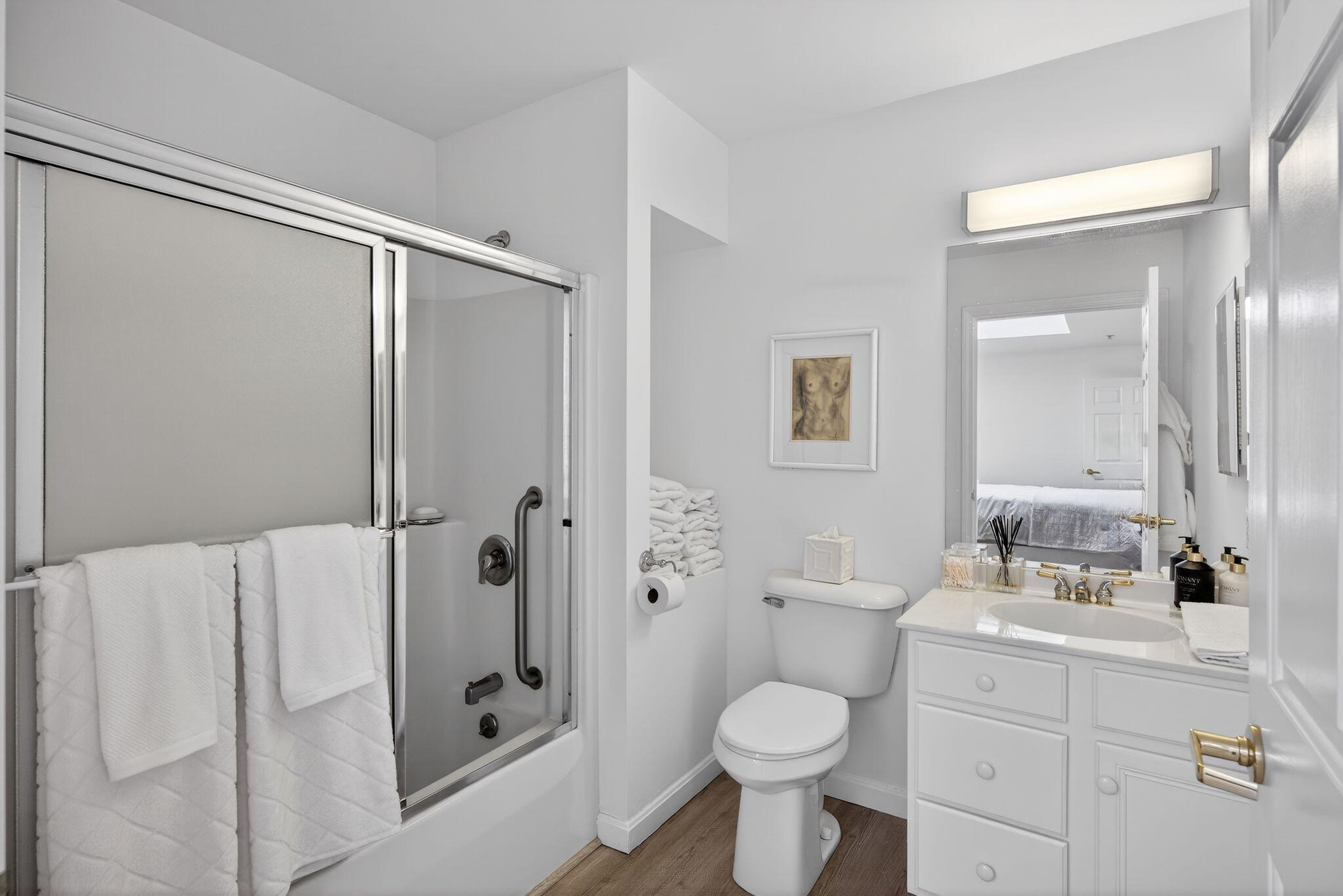 912 Main Street, Unit 308 Chatham, MA 02633 - Photo 45 of 65 a bathroom with a shower toilet sink and mirror