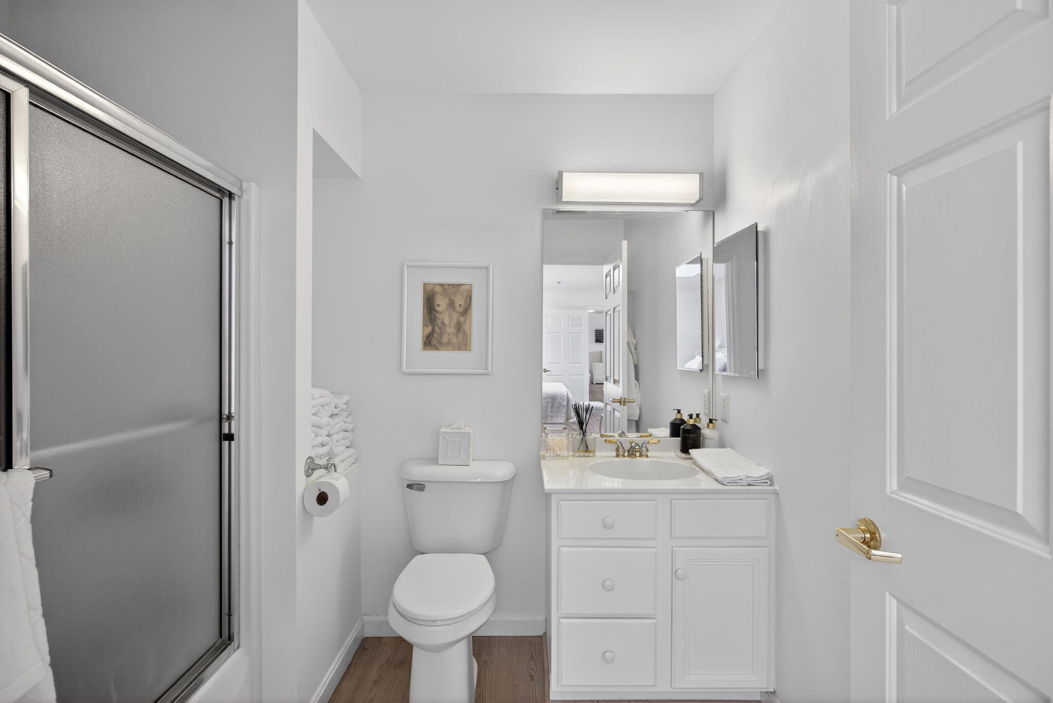 912 Main Street, Unit 308 Chatham, MA 02633 - Photo 46 of 65 a bathroom with a sink toilet a shower and a mirror