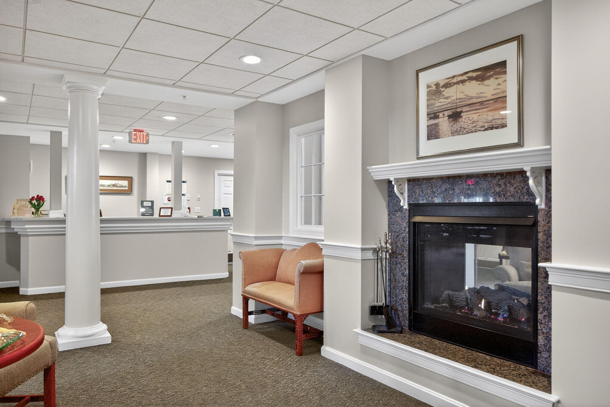 912 Main Street, Unit 308 Chatham, MA 02633 - Photo 49 of 65 a living room with furniture and a fireplace
