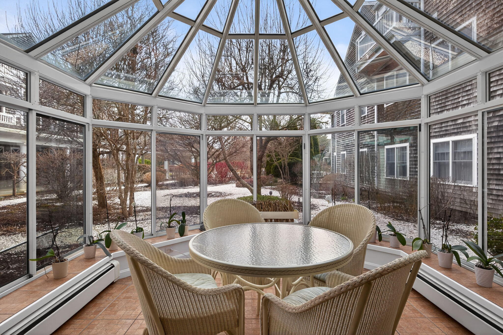 912 Main Street, Unit 308 Chatham, MA 02633 - Photo 52 of 65 a dining room with a large window and furniture