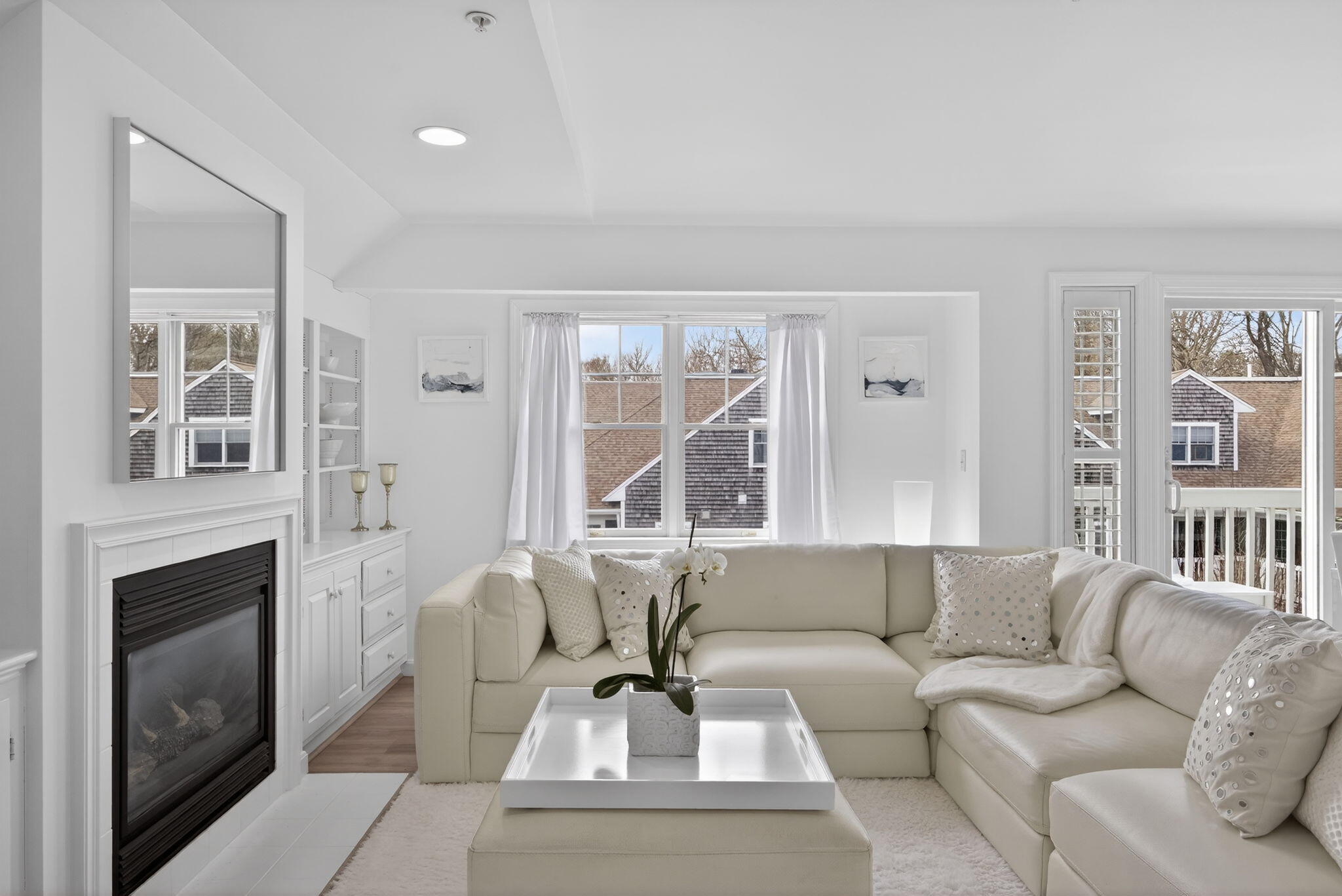 912 Main Street, Unit 308 Chatham, MA 02633 - Photo 6 of 65 a living room with furniture and a fireplace