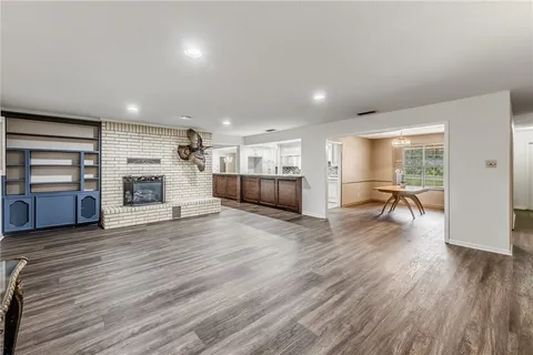a room with furniture and a wooden floor