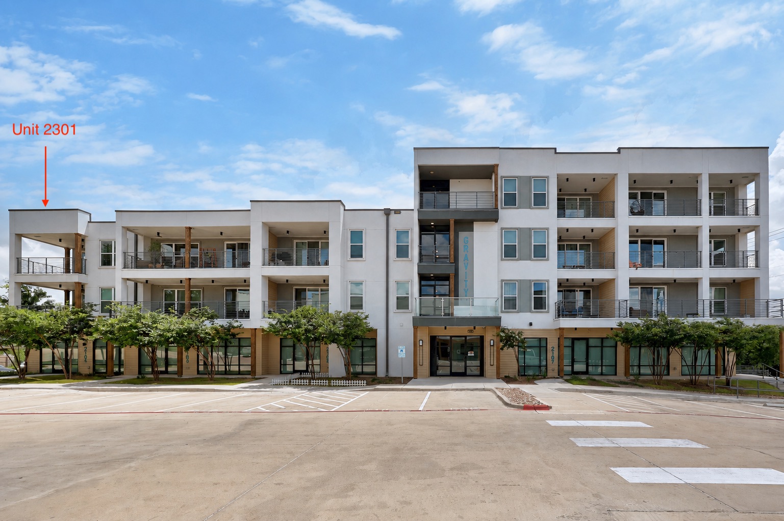 4801 Springdale Road, Unit 2301 Austin, TX 78723 - Photo 2 of 36 Modern multi-story building featuring private balconies and ample parking for residents.