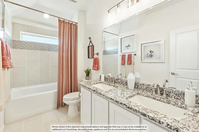 a bathroom with a granite countertop sink mirror vanity bathtub and toilet