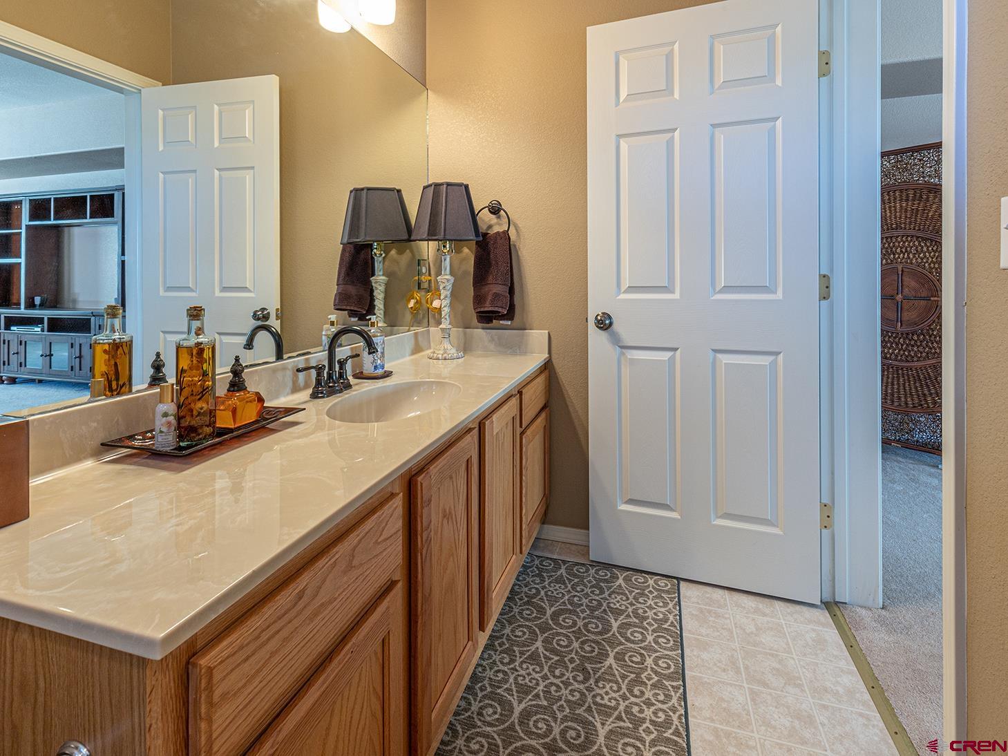 343 Jenkins Ranch Road Durango, CO 81301 - Photo 14 of 35 a bathroom with a sink and a mirror
