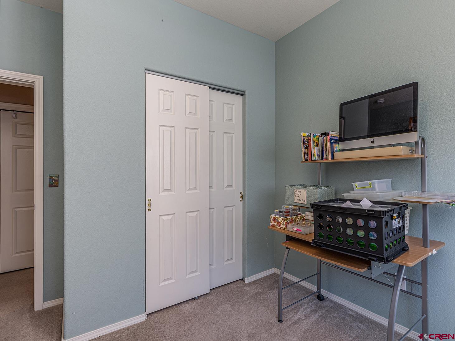 343 Jenkins Ranch Road Durango, CO 81301 - Photo 23 of 35 a living room with furniture and a flat screen tv