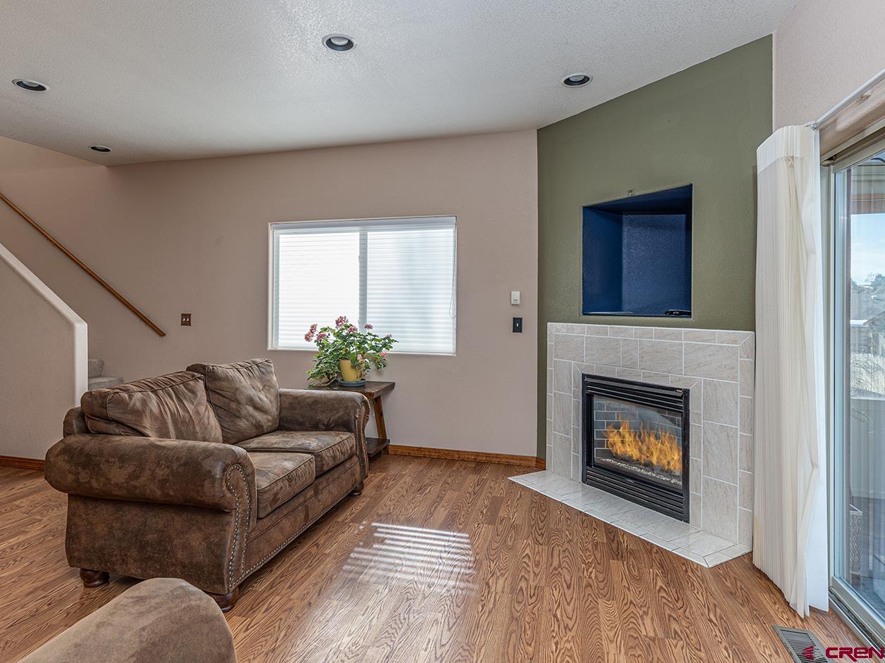 343 Jenkins Ranch Road Durango, CO 81301 - Photo 4 of 35 a living room with furniture and a fireplace