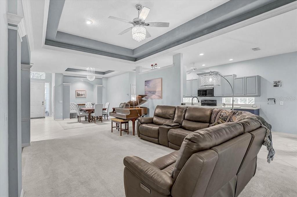 103 Bishopscourt Road Osprey, FL 34229 - Photo 8 of 55 a living room with furniture and a chandelier