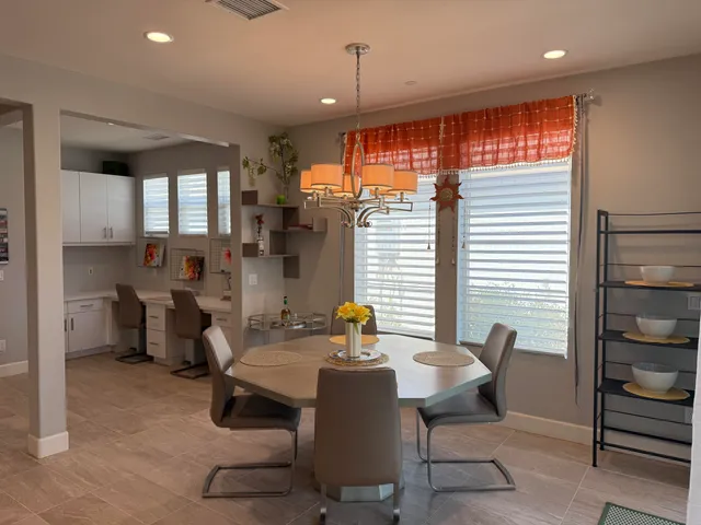 a view of a dining room with furniture window and outside view