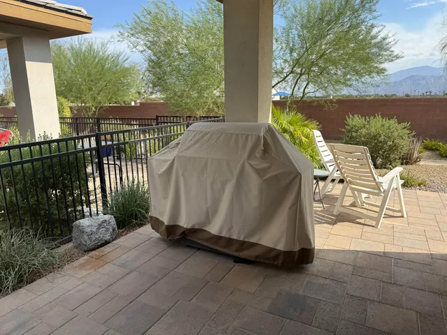 a front view of house with a bench in front of house