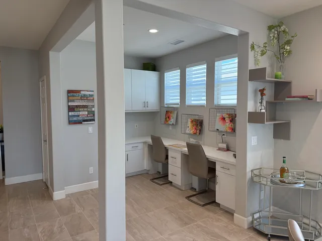 a very nice looking open dining room with kitchen island and a window