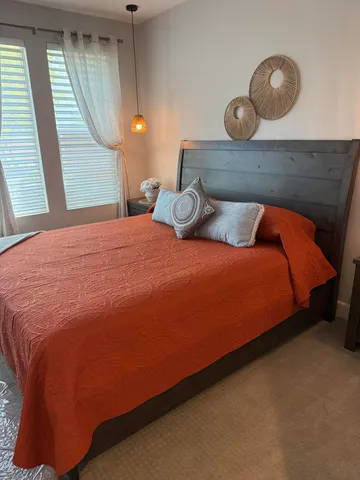 a bathroom with double sink and a mirror