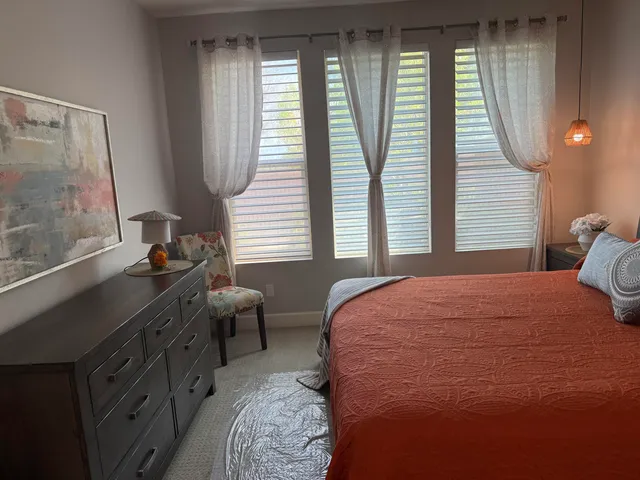 a bathroom with a shower sink and mirror