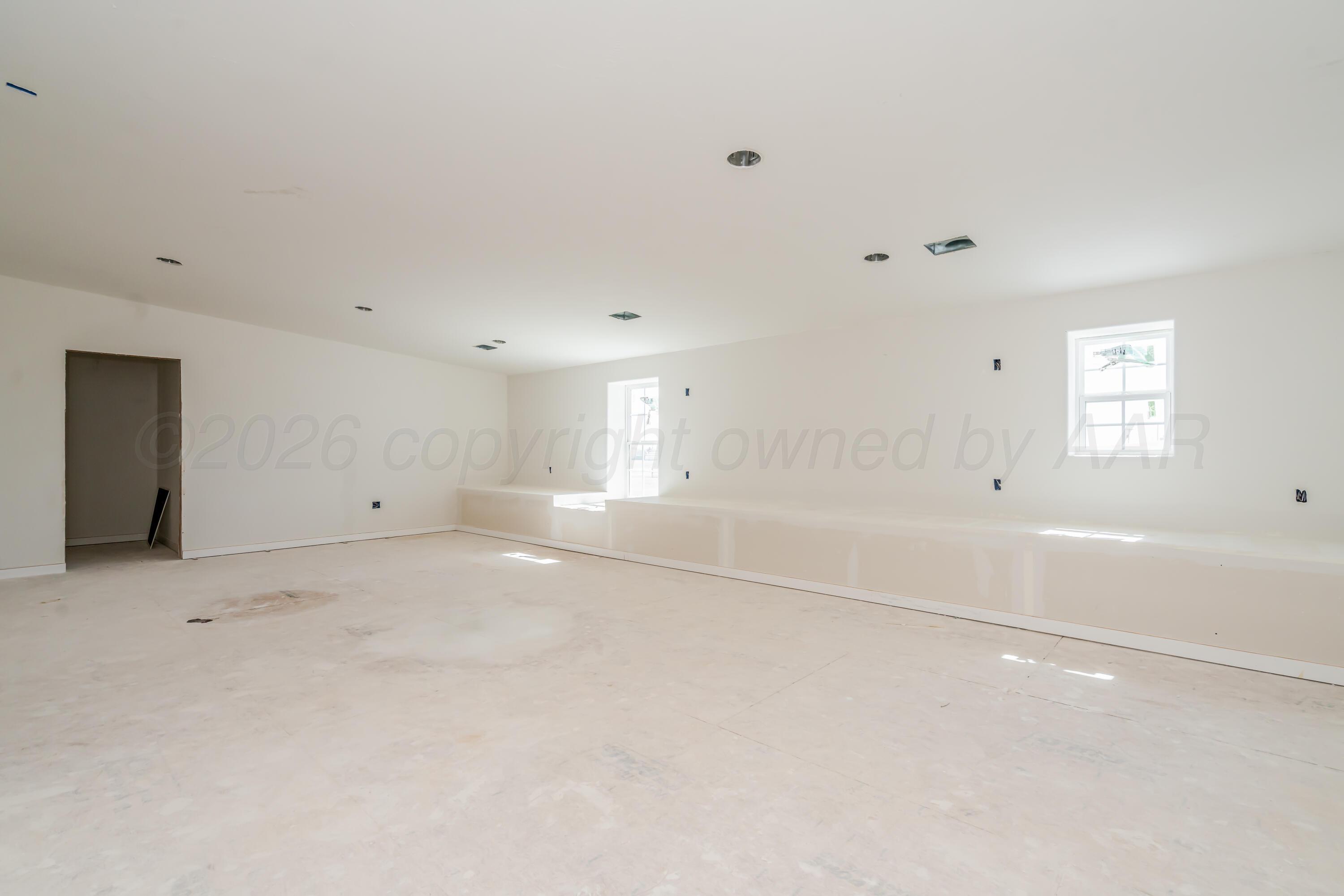 19900 Indian Spring Trail Amarillo, TX 79124 - Photo 22 of 33 an empty room with windows and closet