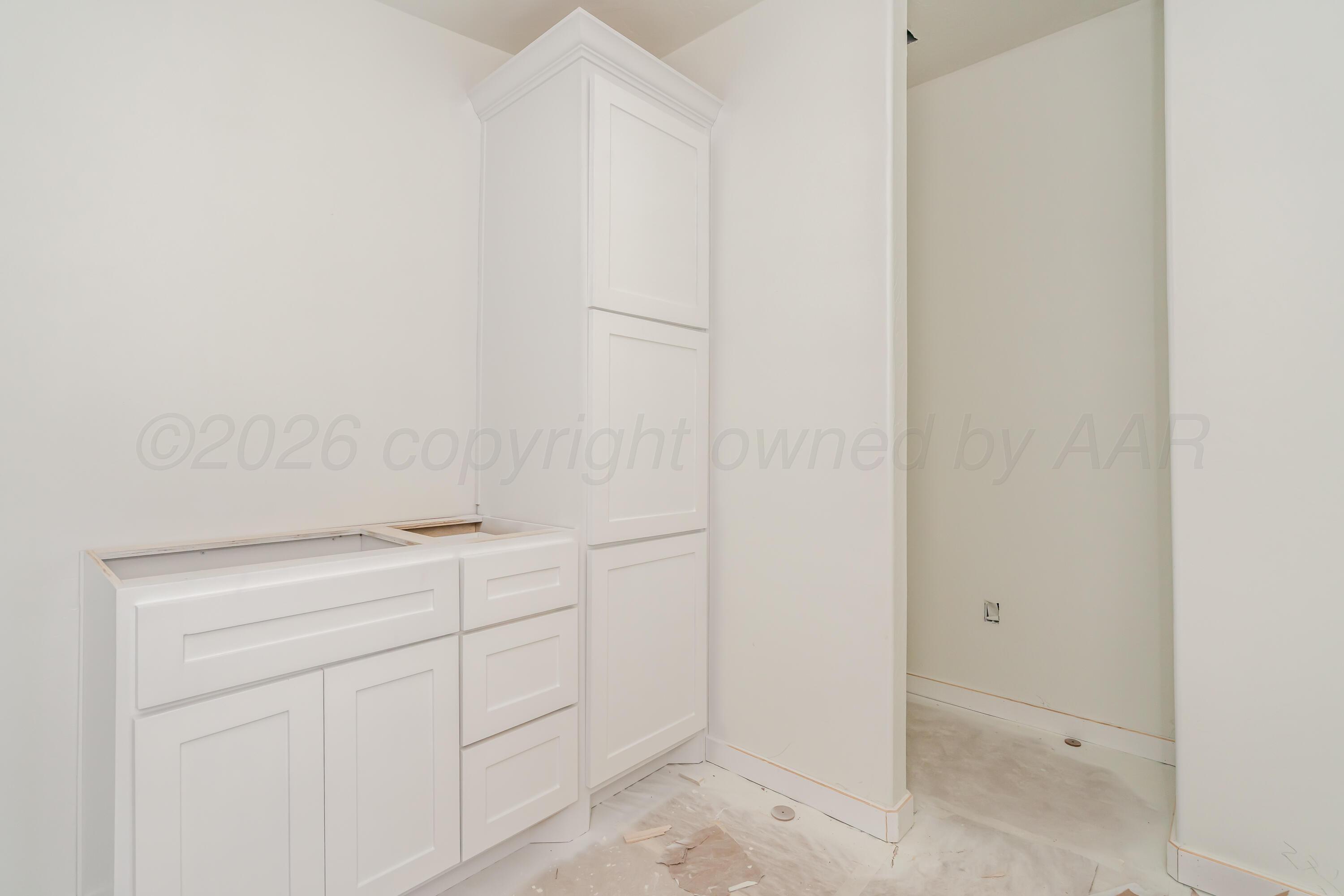 19900 Indian Spring Trail Amarillo, TX 79124 - Photo 25 of 33 a view of cabinets and utility area
