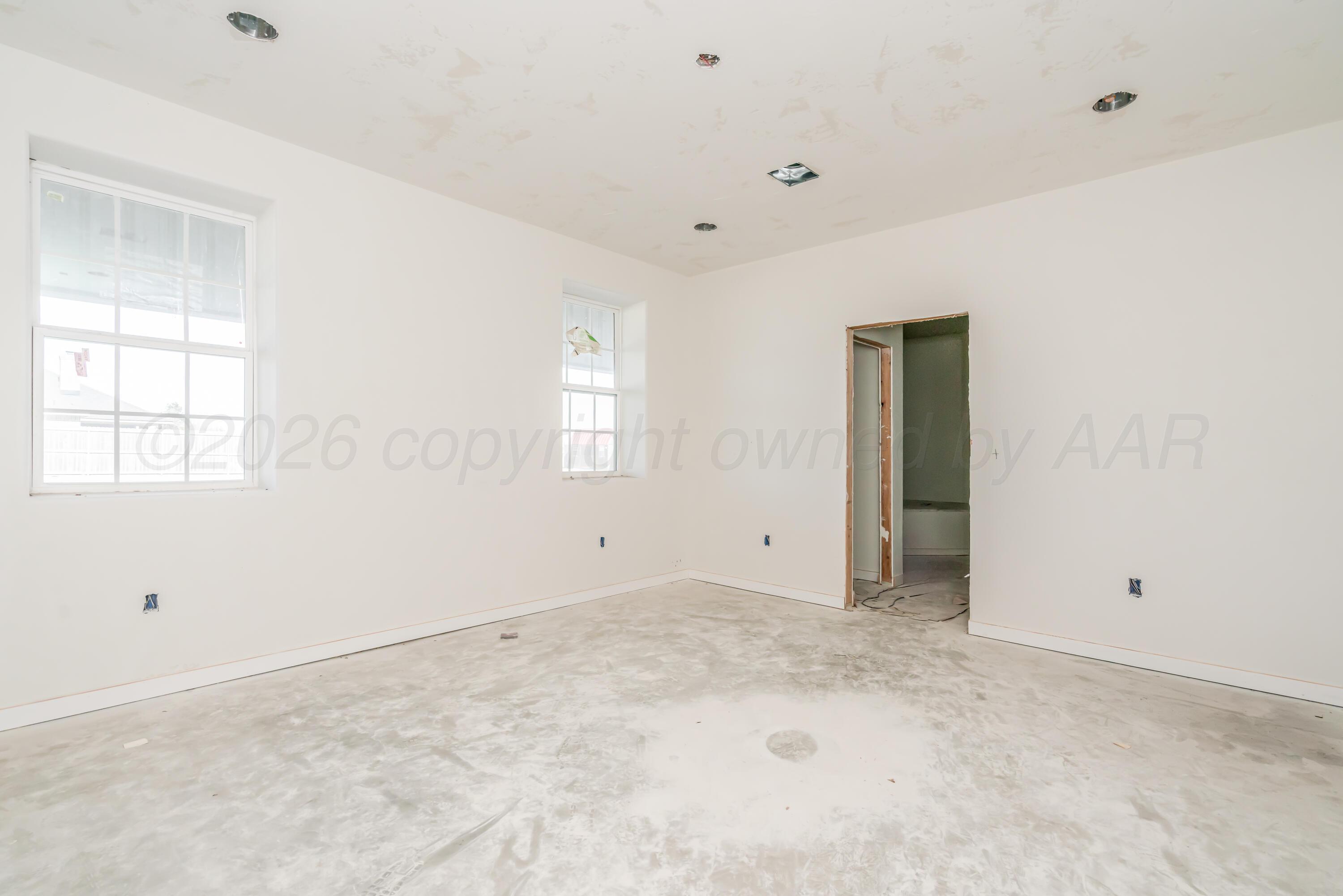 19900 Indian Spring Trail Amarillo, TX 79124 - Photo 8 of 33 a view of an empty room with a window