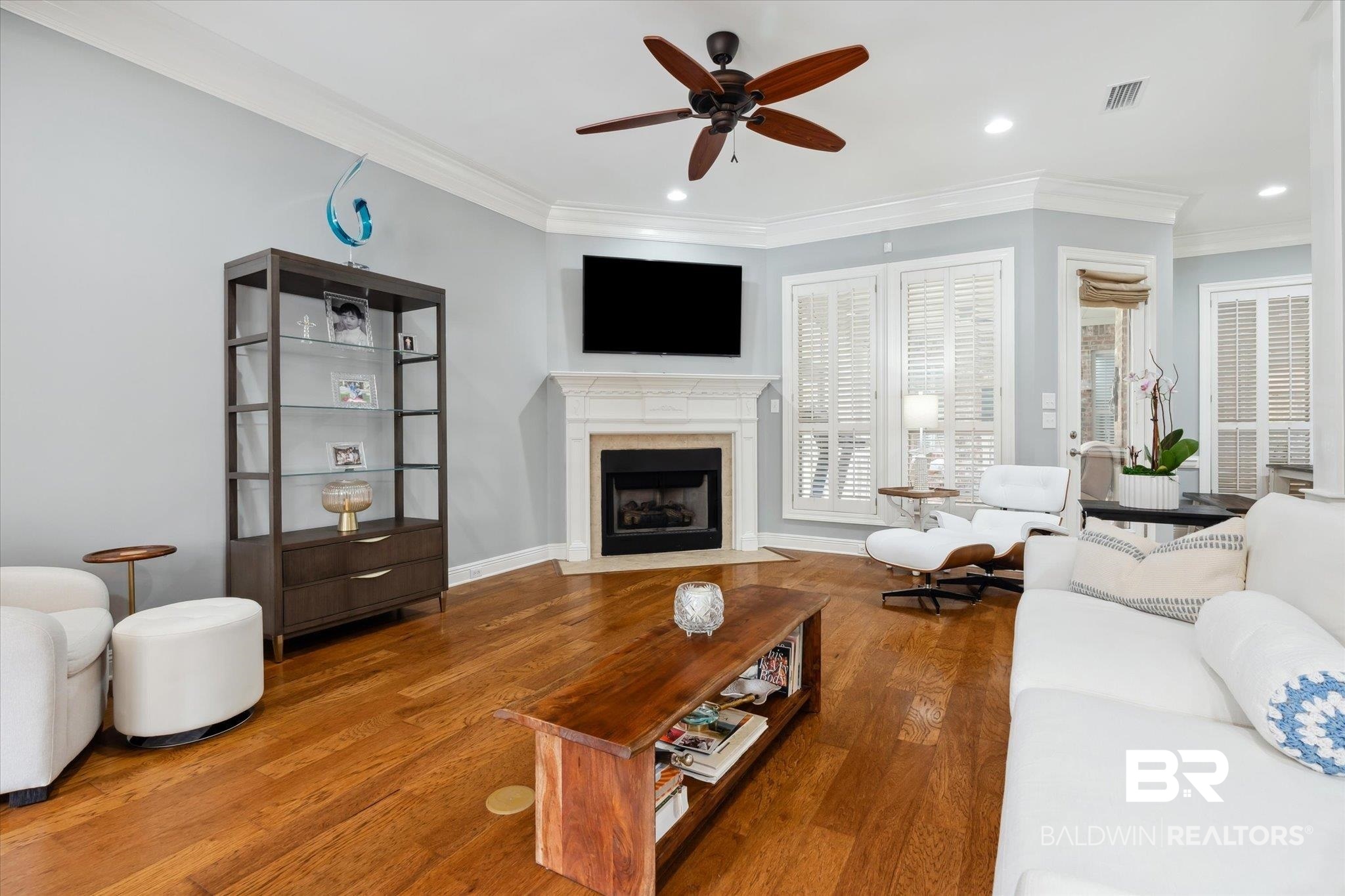 804 Country Club Road Mobile, AL 36609 - Photo 43 of 63 Living room featuring hardwood / wood-style flooring, ornamental molding, a fireplace, and ceiling fan