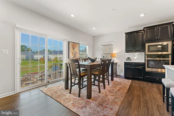 a living room with furniture or wooden floor and a fireplace