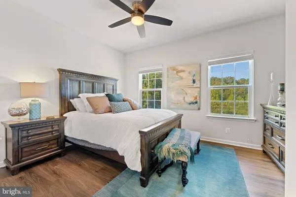 a bedroom with a bed and a flat tv screen