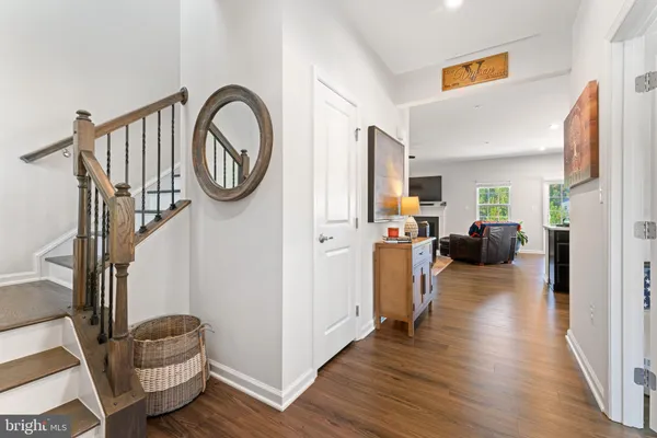 a view of living room and kitchen with furniture wooden floor and window