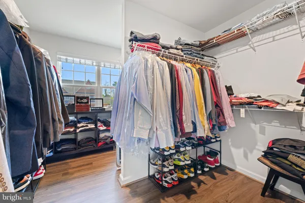 a spacious bathroom with a shower sink and mirror