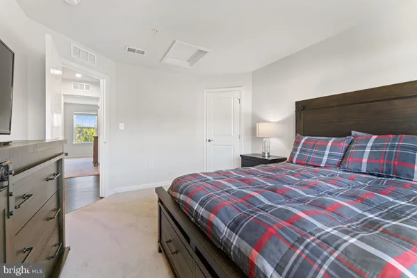 a bathroom with a sink toilet double vanity and shower