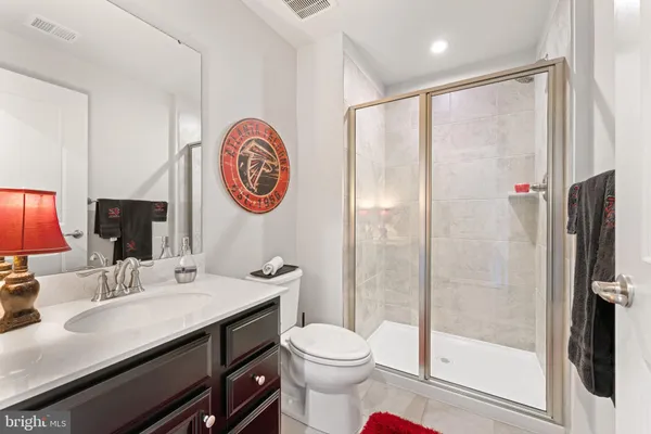 a view of a patio with couches and table and chairs and garden